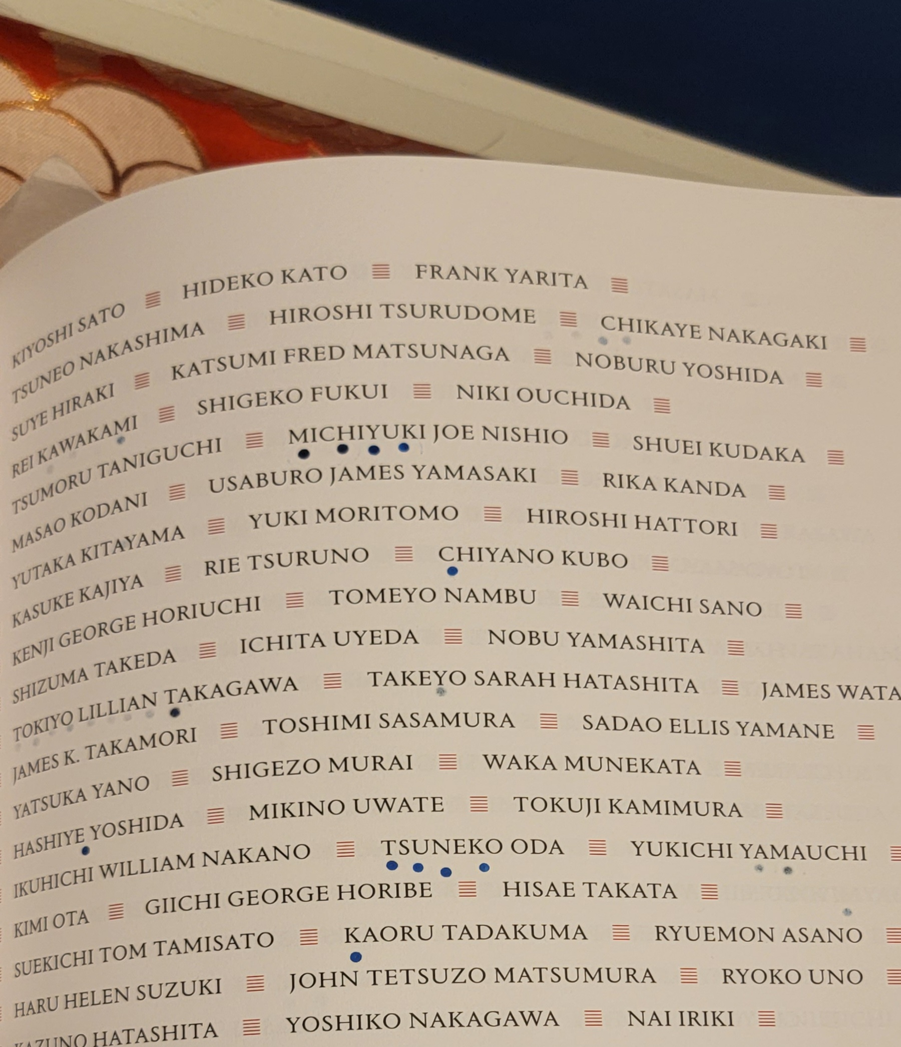 A page from the sacred Ireicho showing names marked with a hanko stamp